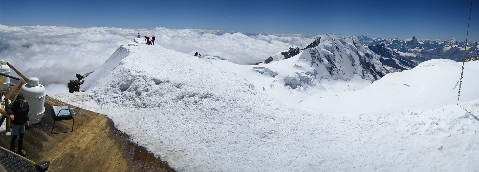 Zumsteinspitze and Signalkuppe: on top of Signalkuppe; on the left side: snow melting machine of Rifugio Regina Margherita; from center to right in the background: Lyskamm, Breithorn, Matterhorn, Dent Blanche Zumsteinspitze and Signalkuppe: on top of Signalkuppe; on the left side: snow melting machine of Rifugio Regina Margherita; from center to right in the background: Lyskamm, Breithorn, Matterhorn, Dent Blanche