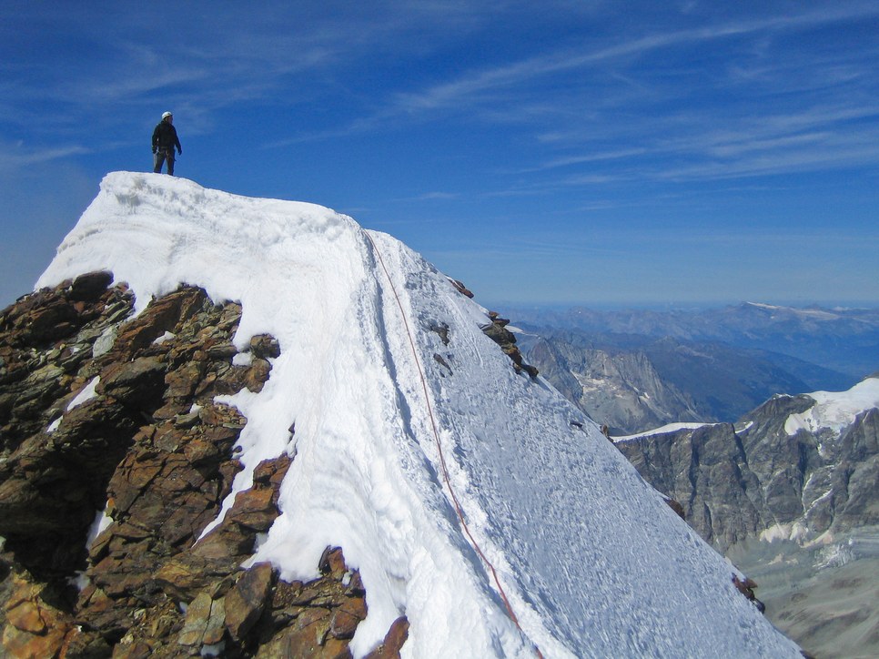 Matterhorn via Hörnli ridge: Peter on summit of the Matterhorn Matterhorn via Hörnli ridge: Peter on summit of the Matterhorn