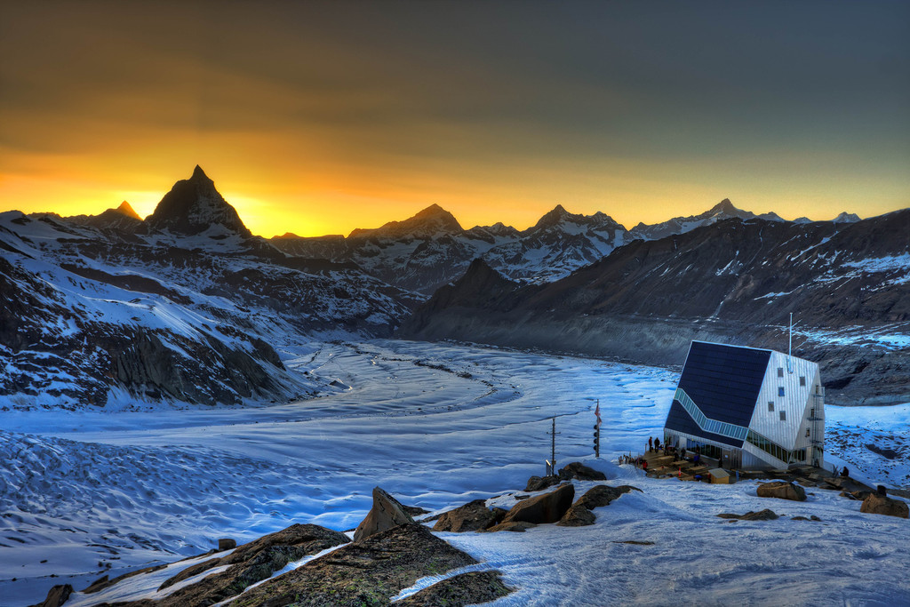 The new Monte Rosa hut with Matterhorn, Dent Blanche and a few more 4000 m peaks at sunset (HDR photo) (keywords: alpen, alps, berg, berge, berghütte, dent blanche, gornergrat, hdr, leute, matterhorn, monte rosa hut, obergabelhorn, person, schweiz, sonnenuntergang, switzerland, valais, wallis, wellenkuppe, wolke, wolken, zinalrothorn, clouds, glacier, mountain, mountain hut, mountains, people, sunset, swiss) The new Monte Rosa hut with Matterhorn, Dent Blanche and a few more 4000 m peaks at sunset (HDR photo) (keywords: alpen, alps, berg, berge, berghütte, dent blanche, gornergrat, hdr, leute, matterhorn, monte rosa hut, obergabelhorn, person, schweiz, sonnenuntergang, switzerland, valais, wallis, wellenkuppe, wolke, wolken, zinalrothorn, clouds, glacier, mountain, mountain hut, mountains, people, sunset, swiss)