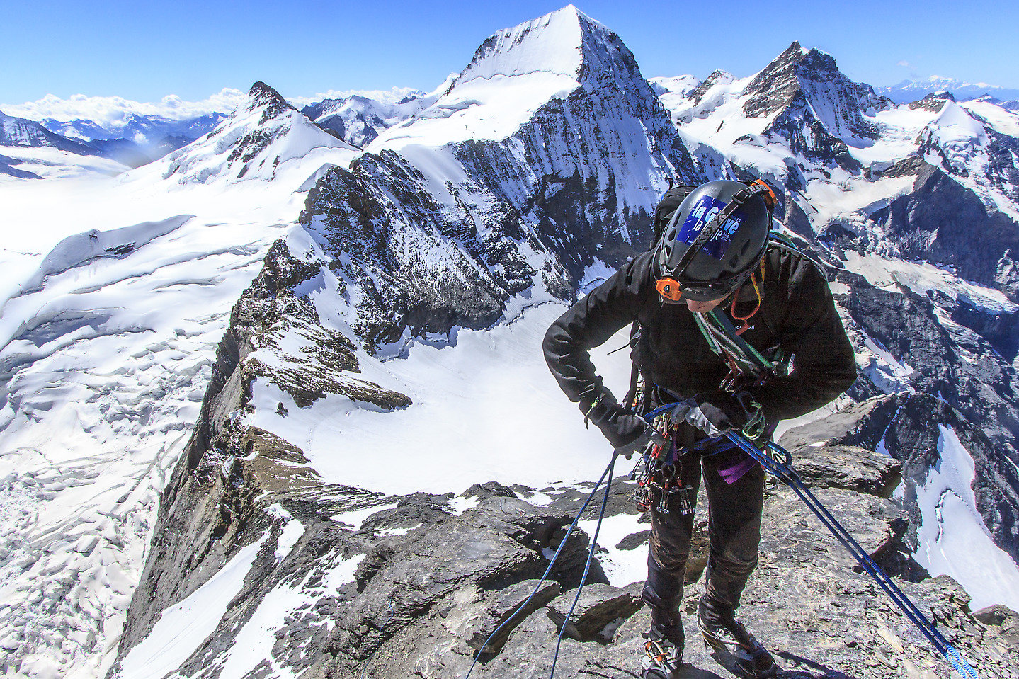 Dan rapelling with Mönch in the background (keywords: Dan, Eiger, Mittellegigrat, Mönch, Moench, rappell, climber, alpinist, climber, mountaineer, climber, Kletterer, climber, Bergsteiger, Jungfrau) Dan rapelling with Mönch in the background (keywords: Dan, Eiger, Mittellegigrat, Mönch, Moench, rappell, climber, alpinist, climber, mountaineer, climber, Kletterer, climber, Bergsteiger, Jungfrau)